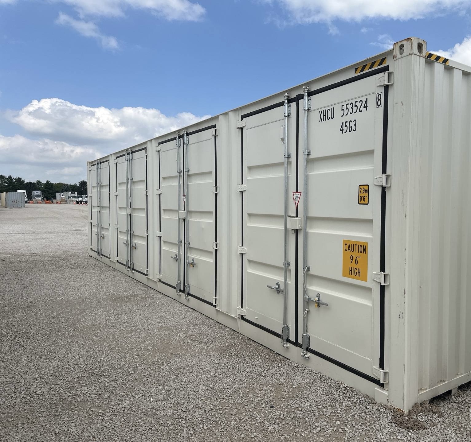 White high cube shipping containers with multiple cargo doors available for storage access.