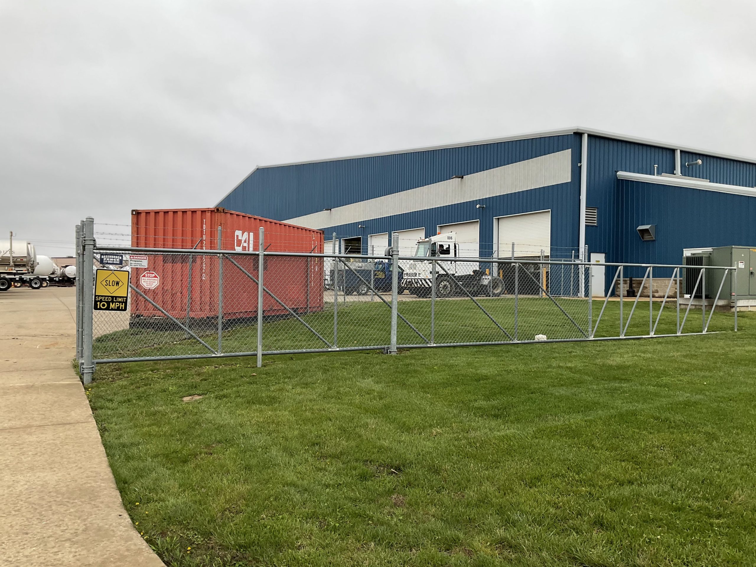Shipping container storage placed at a business location for equipment, materials, and supply storage.