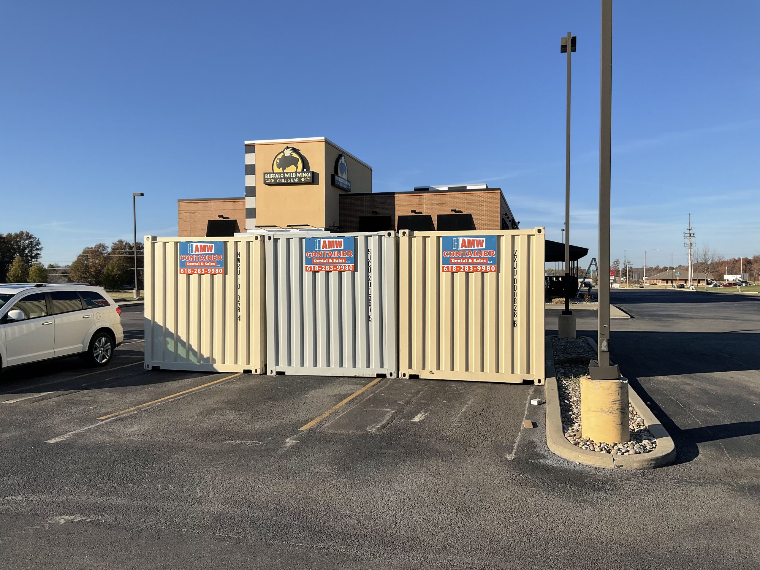 AMW on-site storage containers placed outside a business for convenient shipping container storage.